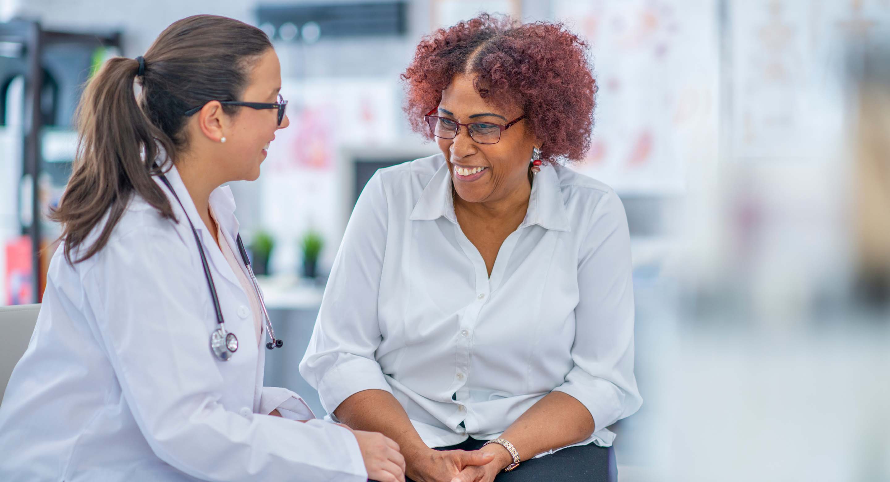A doctor speaking to her patient